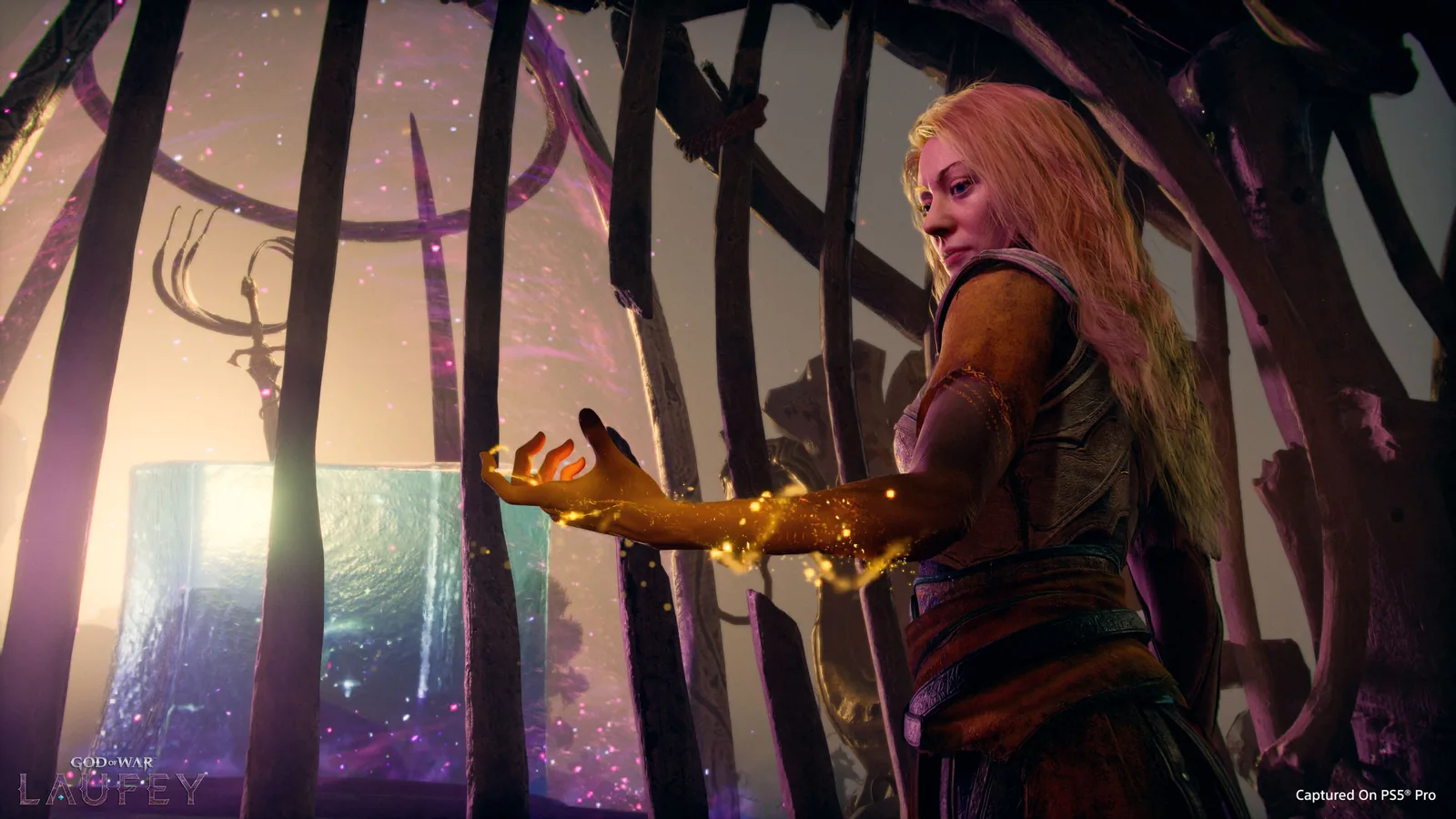 Official God of War Laufey screenshot showing Faye beside the glowing cube Phranque